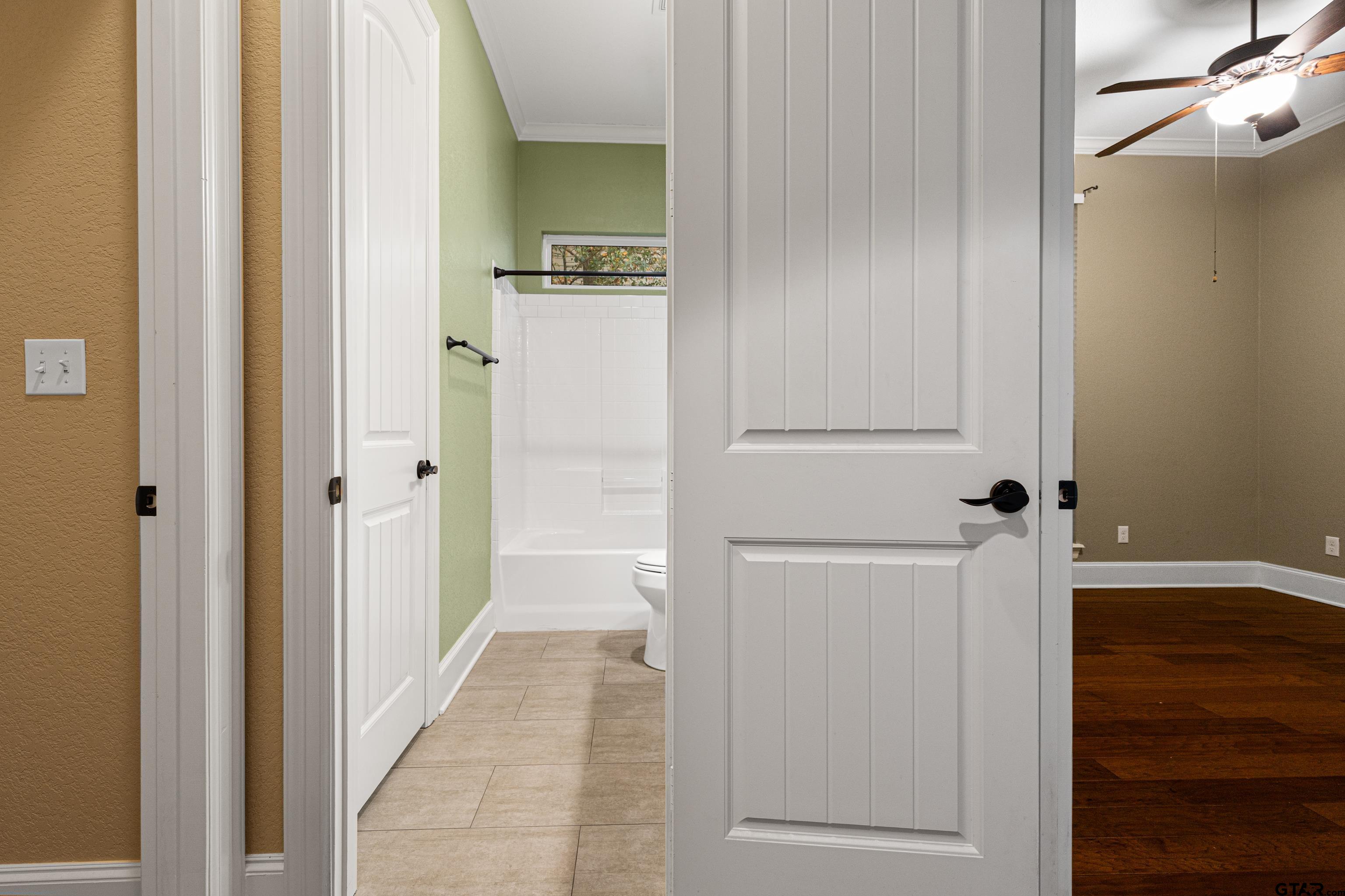 3949 Hanover Place Tyler, TX 75701 - Photo 29 of 43 a view of a hallway with wooden floor