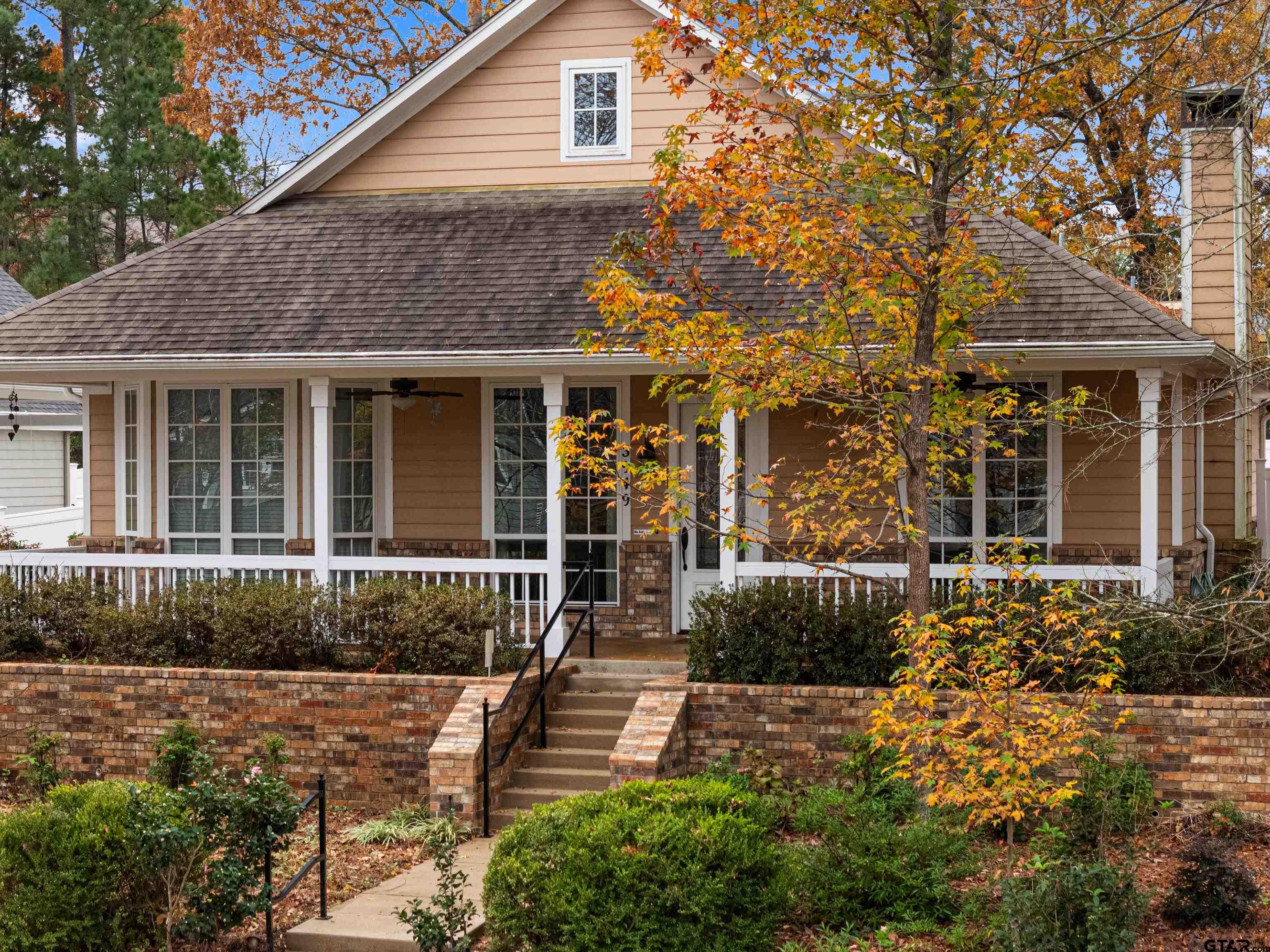 3949 Hanover Place Tyler, TX 75701 - Photo 3 of 43 a front view of a house with a garden
