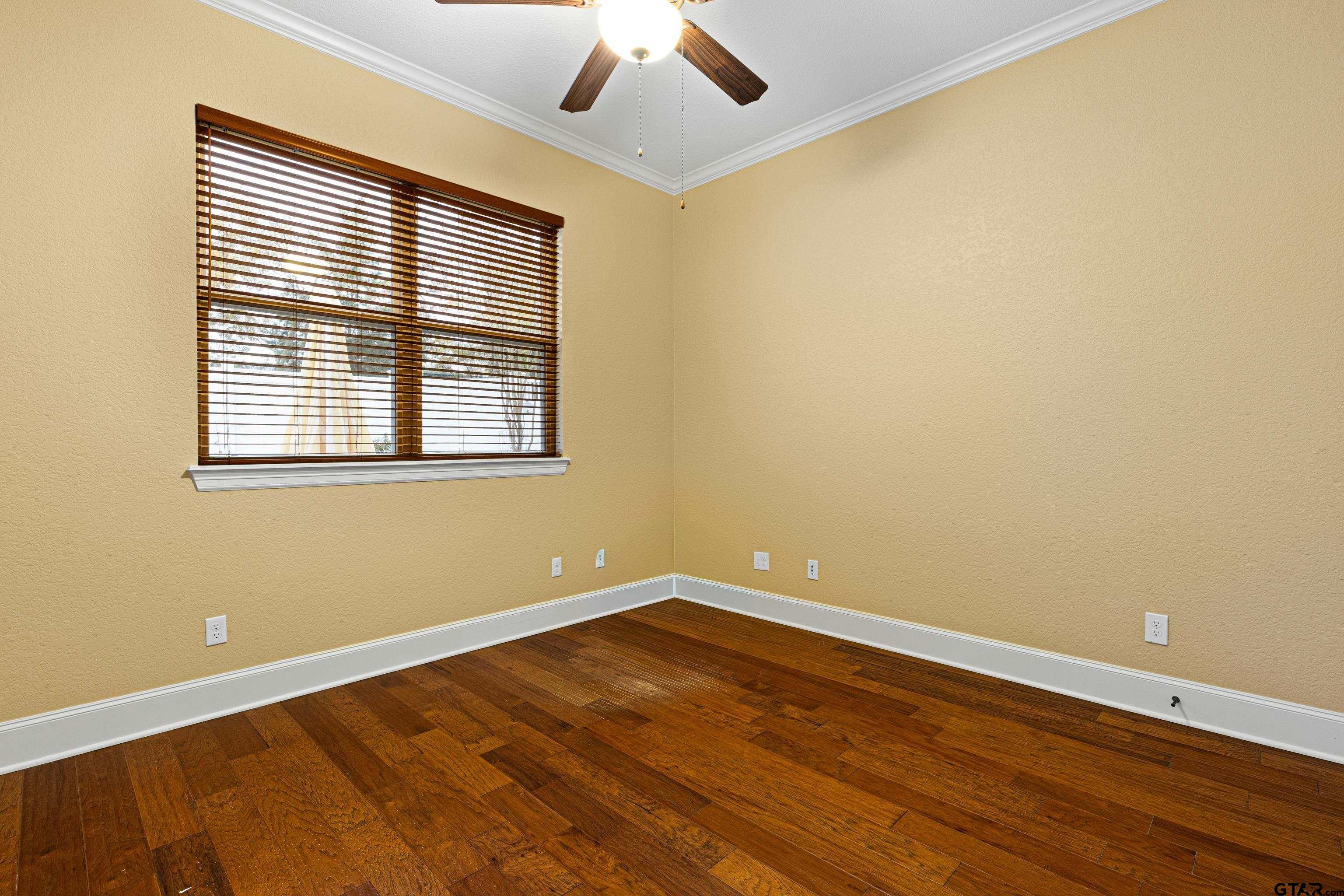 3949 Hanover Place Tyler, TX 75701 - Photo 33 of 43 a view of a room with wooden floor and window