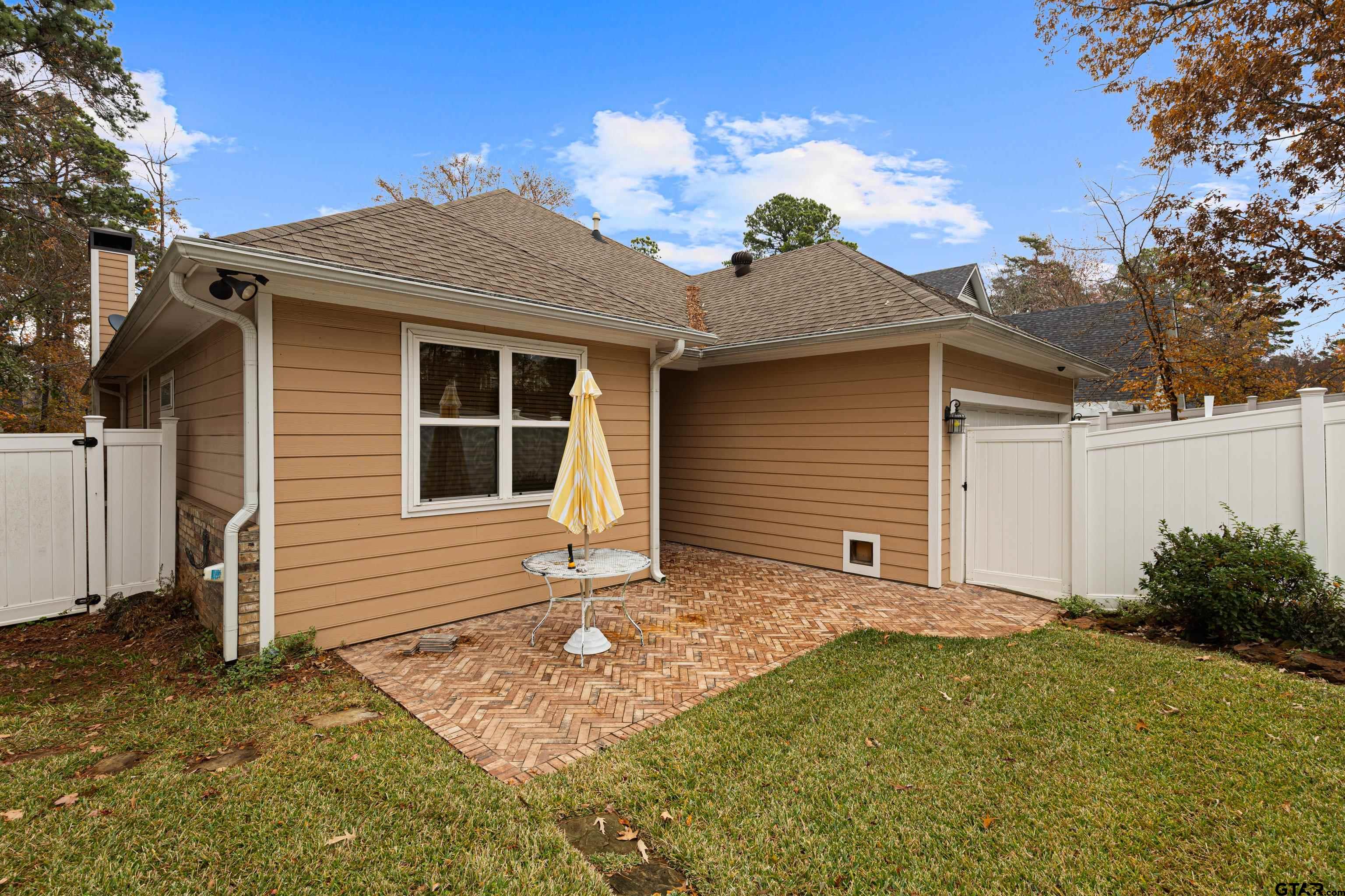 3949 Hanover Place Tyler, TX 75701 - Photo 38 of 43 a front view of a house with garden