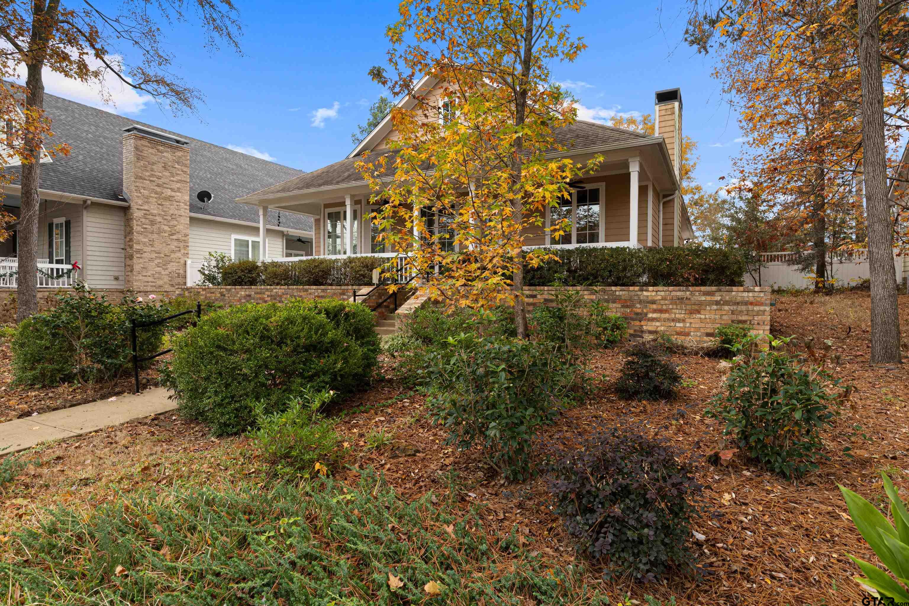 3949 Hanover Place Tyler, TX 75701 - Photo 5 of 43 a view of a large yard with plants and trees