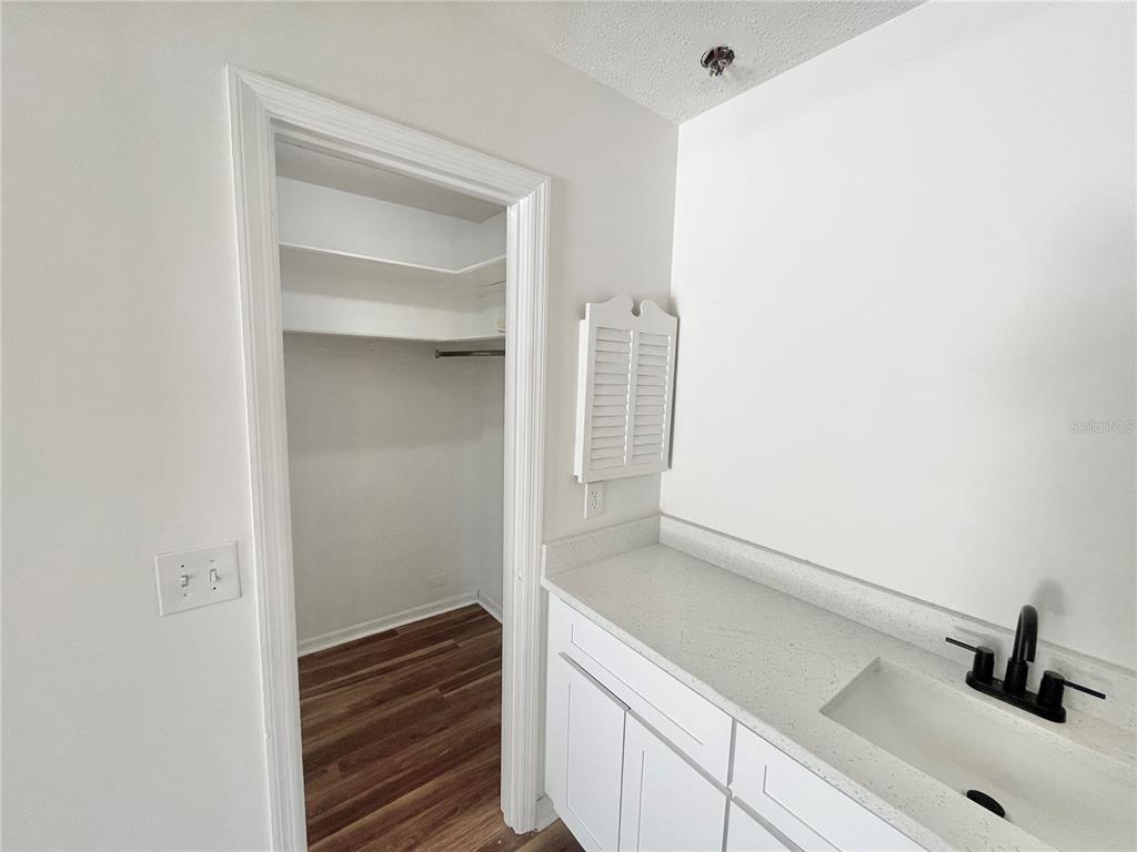 5912 Altec Road Orlando, FL 32808 - Photo 18 of 33 a bathroom with a sink and a mirror