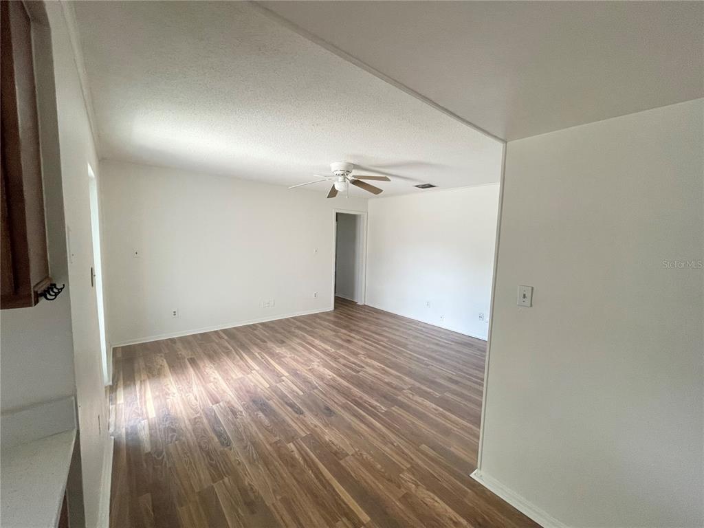 5912 Altec Road Orlando, FL 32808 - Photo 21 of 33 a view of empty room with wooden floor