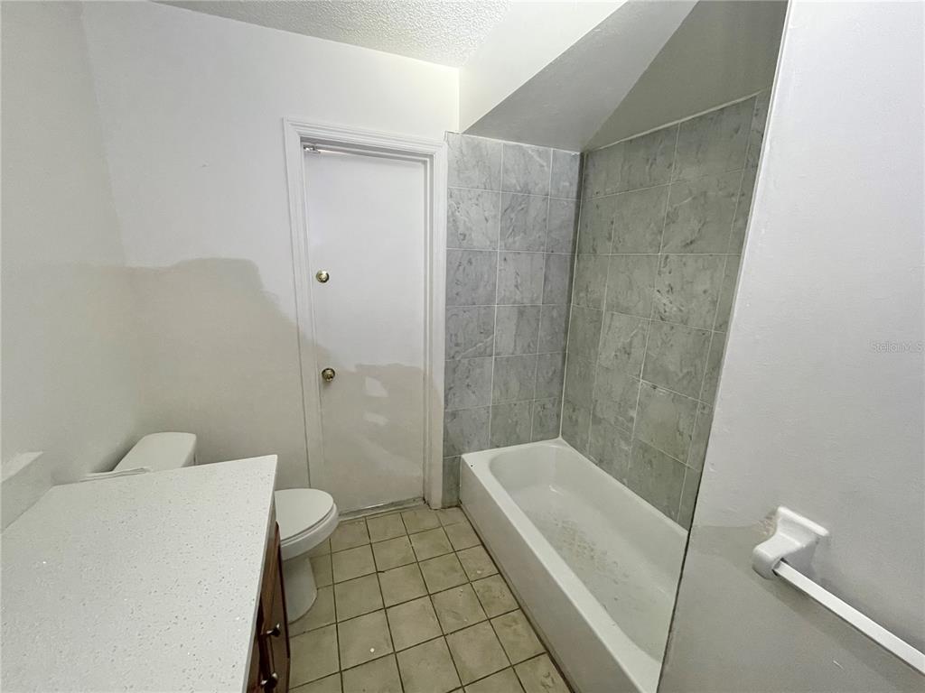 5912 Altec Road Orlando, FL 32808 - Photo 29 of 33 a bathroom with a sink a toilet and shower