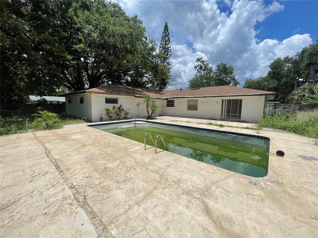 5912 Altec Road Orlando, FL 32808 - Photo 33 of 33 a front view of a house with a yard