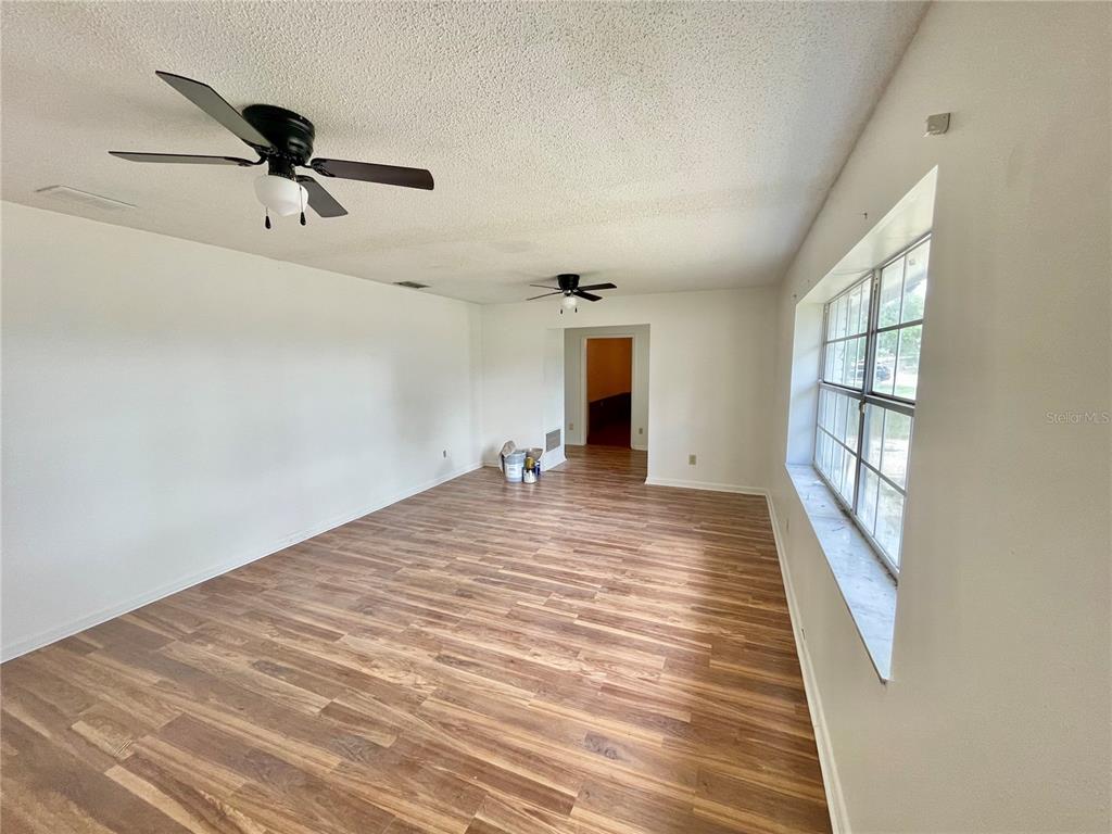 5912 Altec Road Orlando, FL 32808 - Photo 8 of 33 a view of a livingroom with a ceiling fan and window