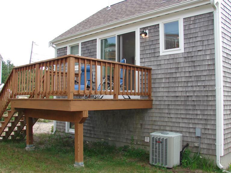 6 Shore Road, Unit 9 Truro, MA 02666 - Photo 18 of 19 a view of a house with wooden deck and furniture