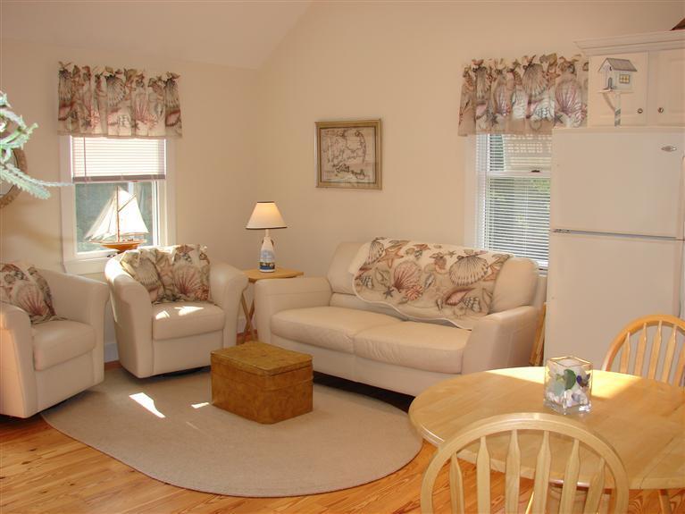 6 Shore Road, Unit 9 Truro, MA 02666 - Photo 5 of 19 a living room with furniture and a painting