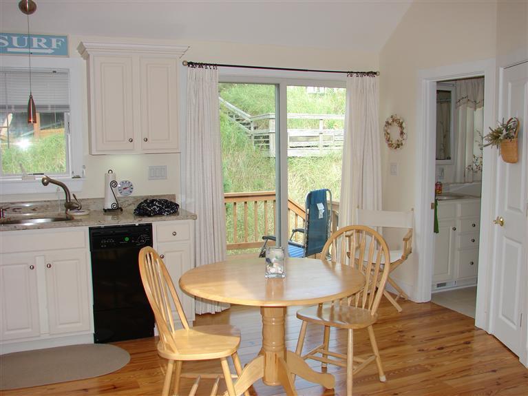 6 Shore Road, Unit 9 Truro, MA 02666 - Photo 7 of 19 a dining room with furniture and window