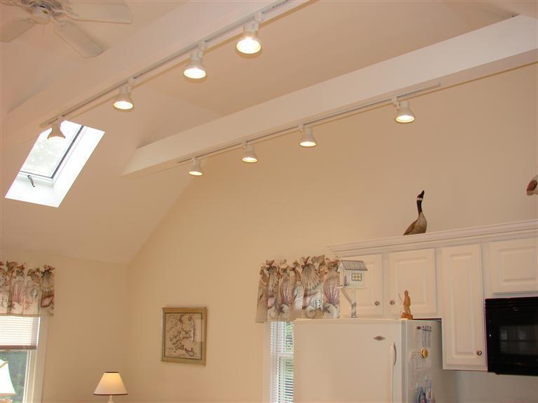 6 Shore Road, Unit 9 Truro, MA 02666 - Photo 8 of 19 a view of a living room with a fireplace and wooden floor