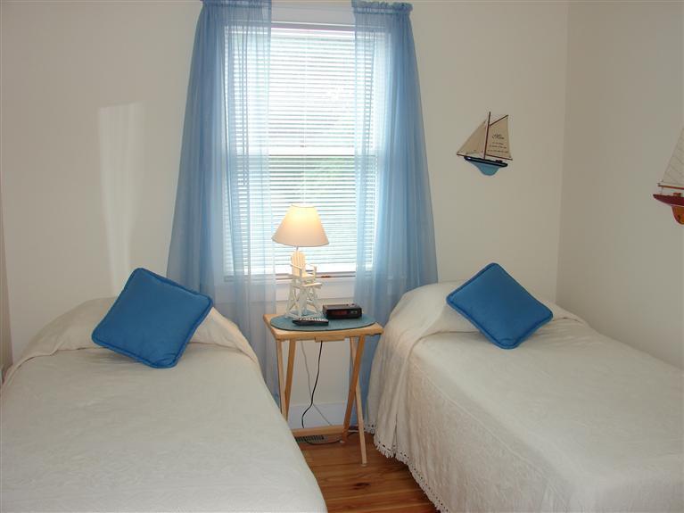 6 Shore Road, Unit 9 Truro, MA 02666 - Photo 9 of 19 a bedroom with bed and window