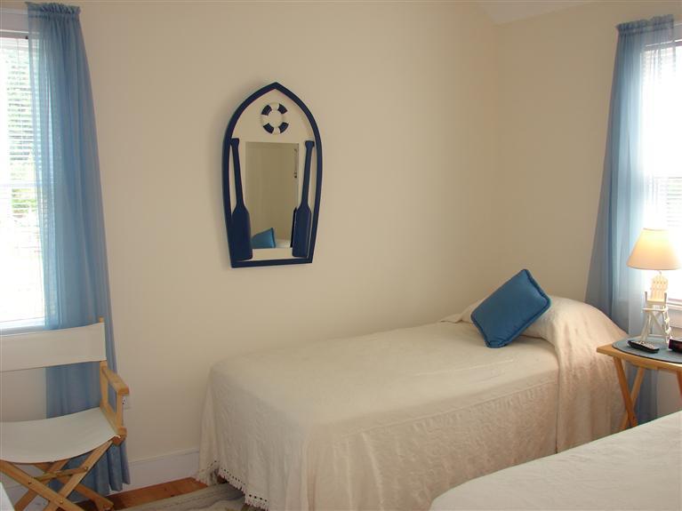 6 Shore Road, Unit 9 Truro, MA 02666 - Photo 10 of 19 a bedroom with a bed and a window