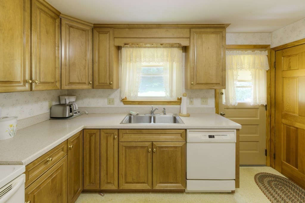 6 Hillsboro Road Worcester, MA 01605 - Photo 8 of 36 a bathroom with a granite countertop sink and a mirror