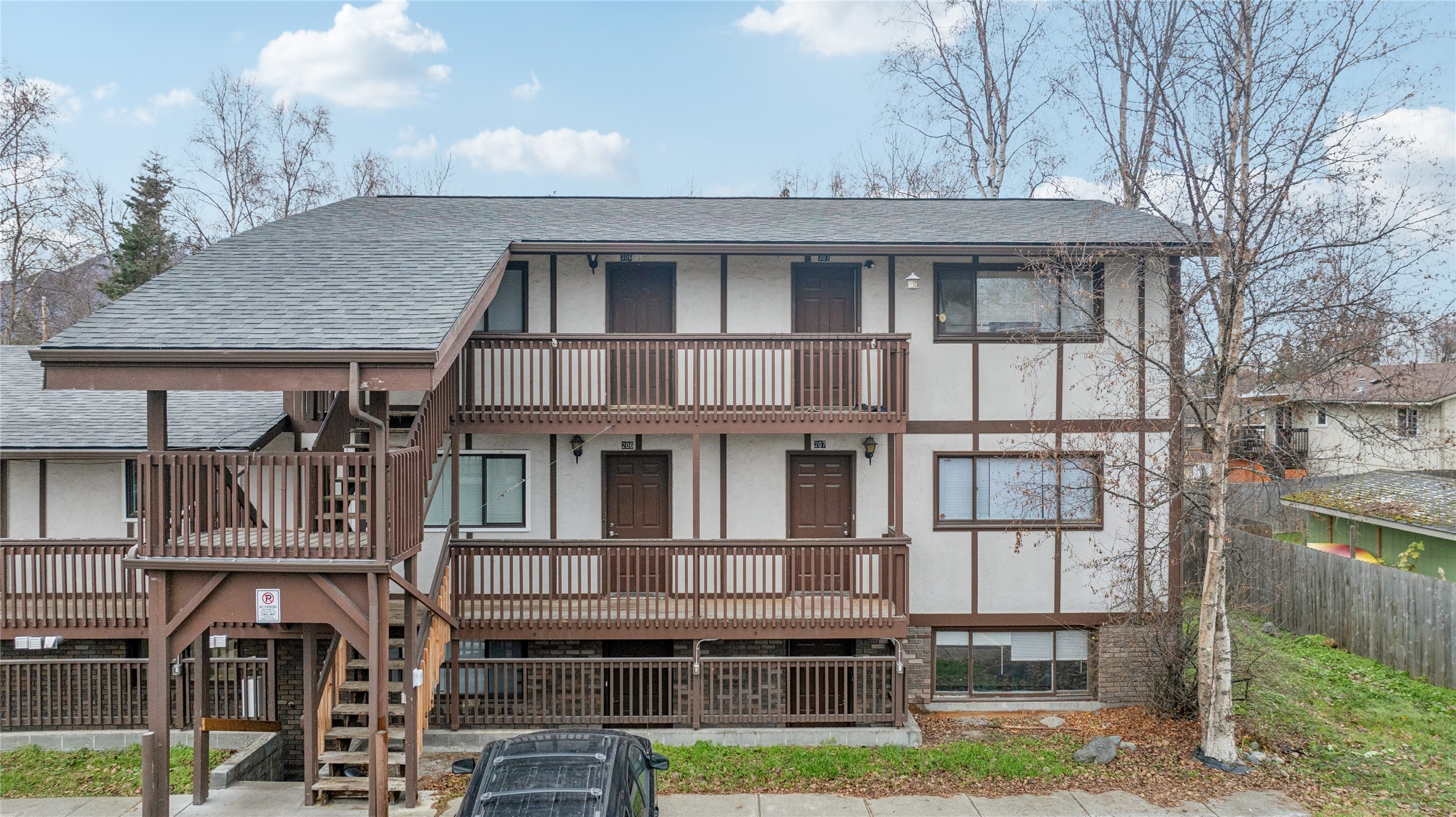 12332 End Street Other, AK 99577 - Photo 13 of 50 a front view of a residential apartment building with a yard