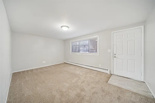 a view of an empty room with a window