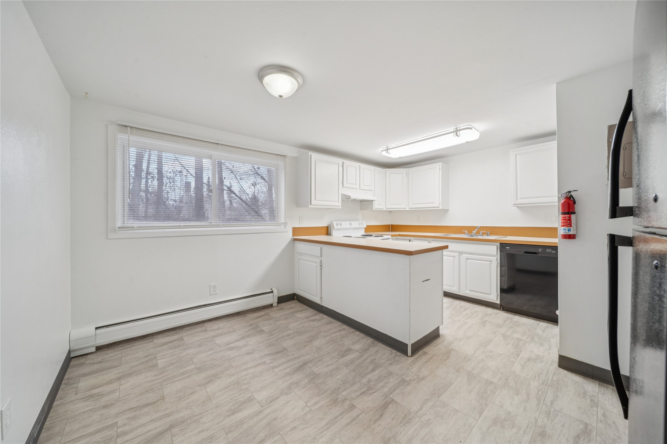 12332 End Street Other, AK 99577 - Photo 20 of 50 a kitchen with a refrigerator and a stove top oven