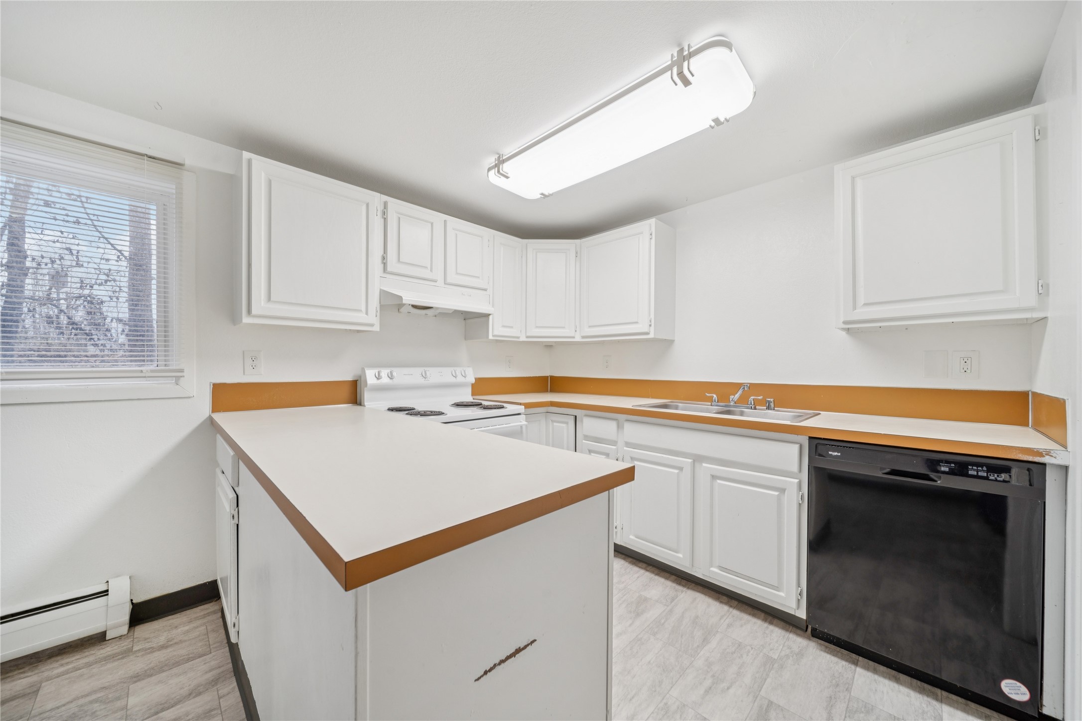 12332 End Street Other, AK 99577 - Photo 23 of 50 a kitchen with a stove sink and cabinets