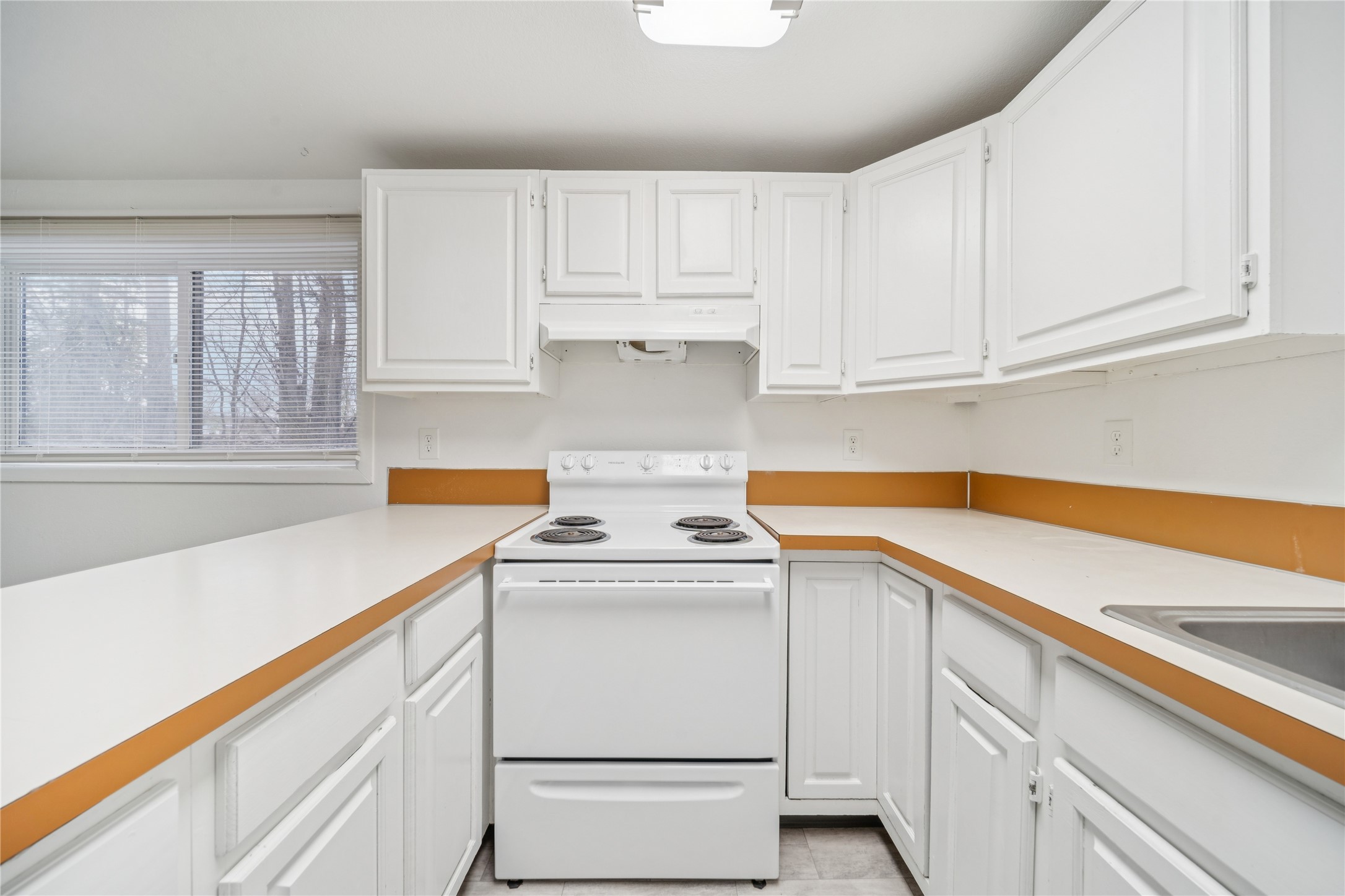 12332 End Street Other, AK 99577 - Photo 26 of 50 a kitchen with white cabinets and white appliances