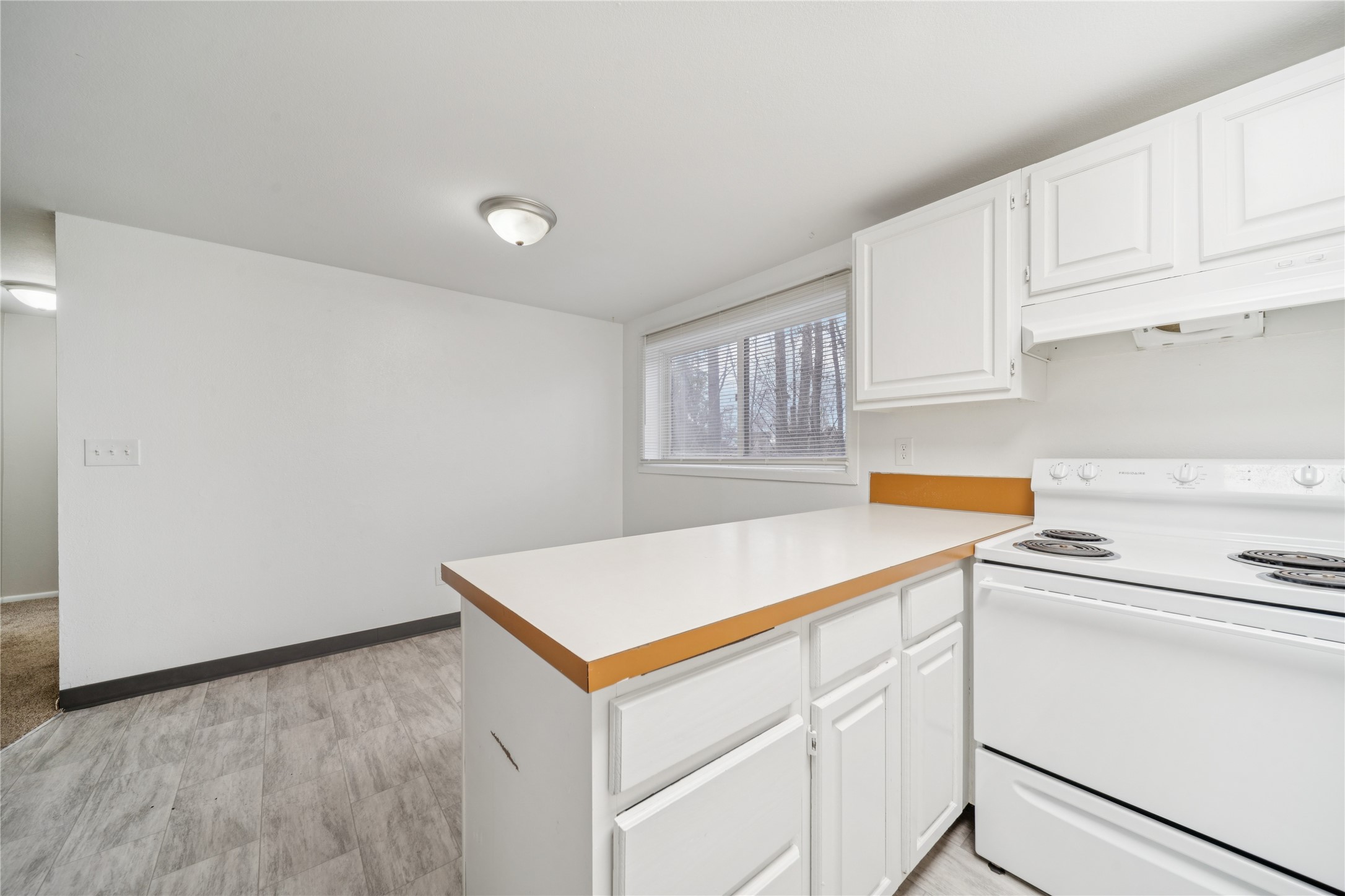 12332 End Street Other, AK 99577 - Photo 27 of 50 a kitchen with white cabinets and white appliances