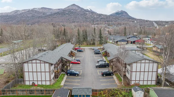 a view of a houses with a yard and furniture