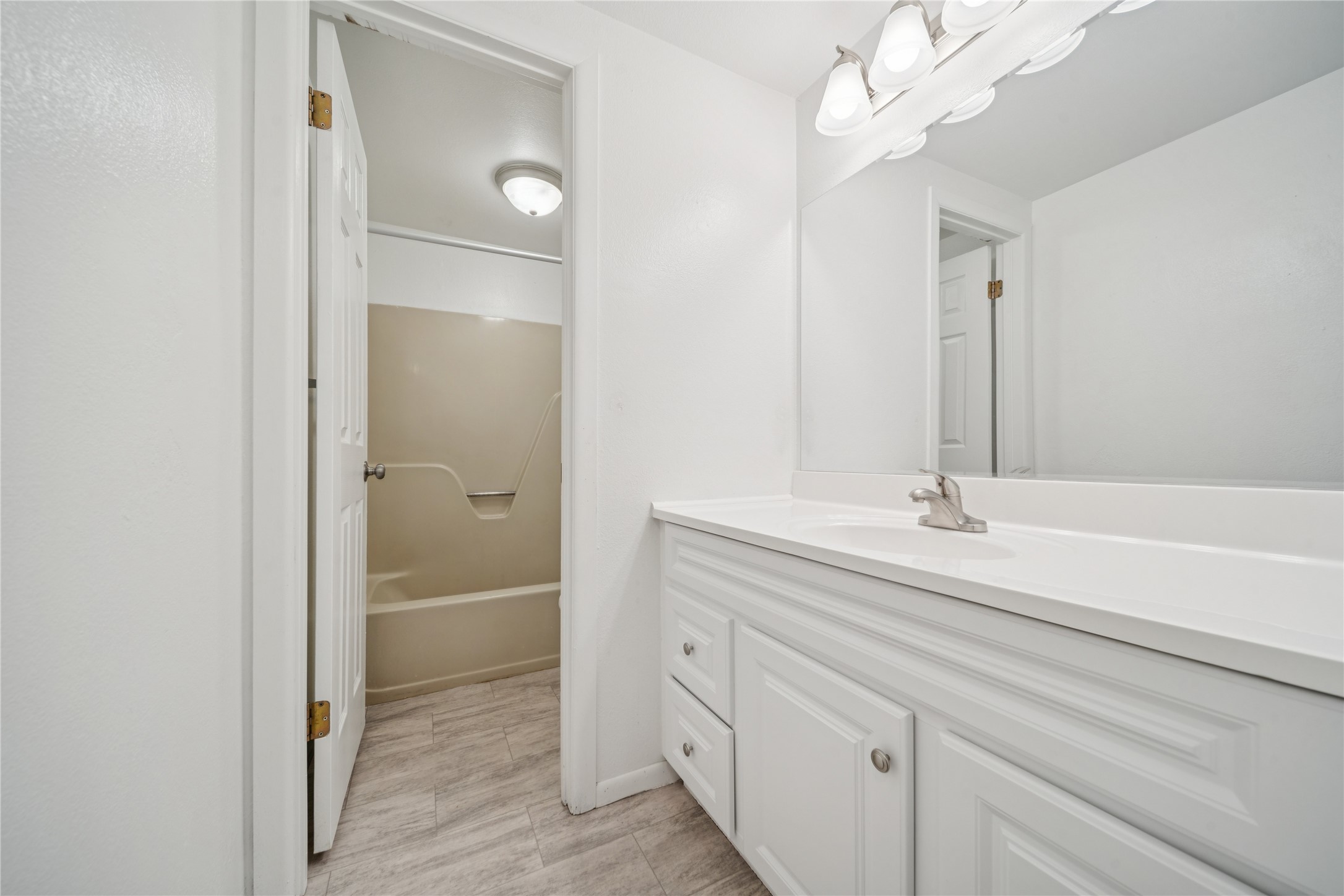 12332 End Street Other, AK 99577 - Photo 32 of 50 a bathroom with a sink a light fixture and a mirror