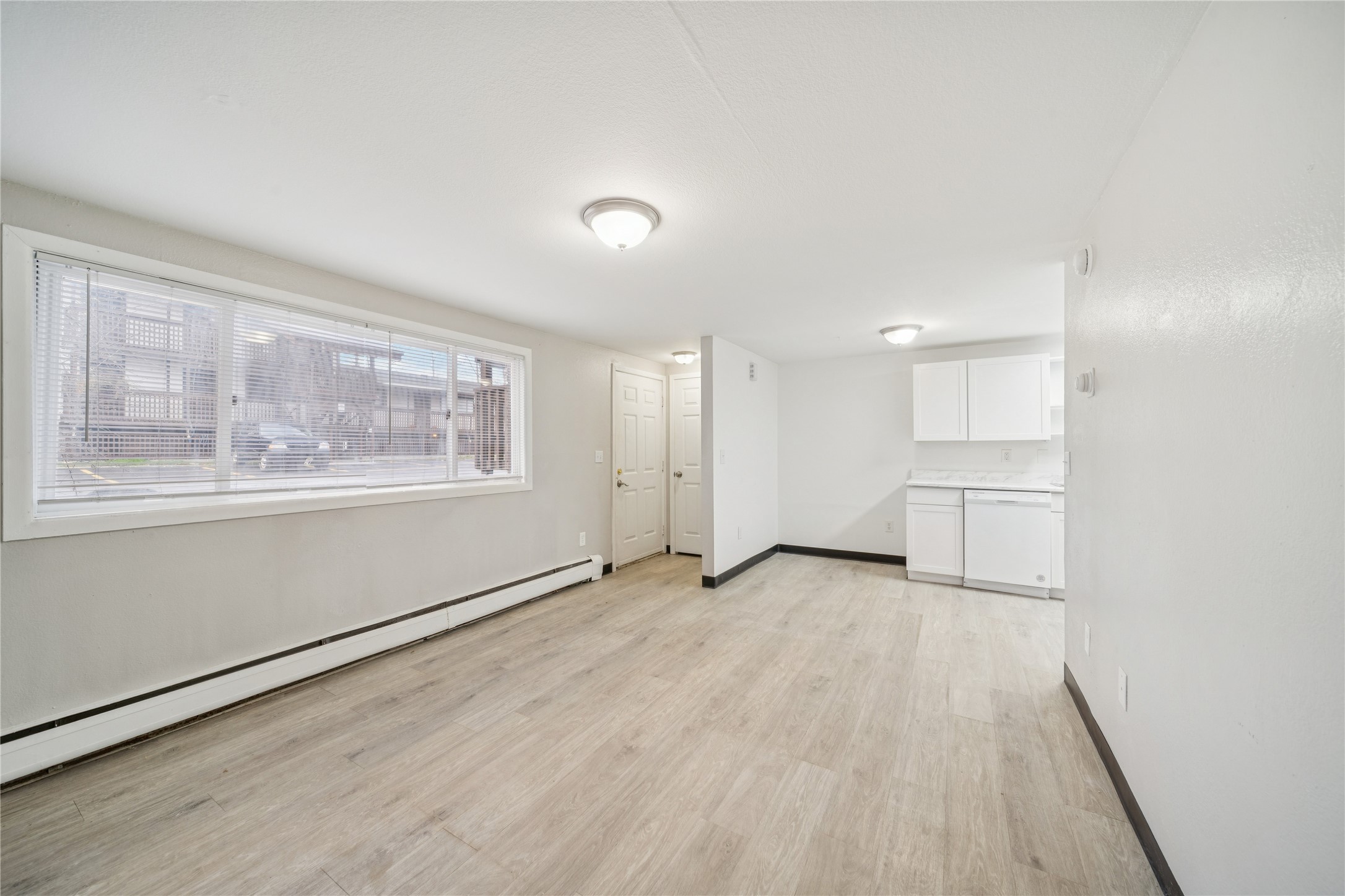 12332 End Street Other, AK 99577 - Photo 40 of 50 an empty room with wooden floor and windows