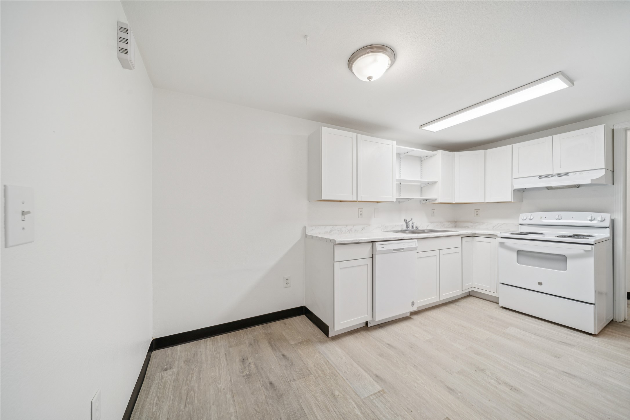 12332 End Street Other, AK 99577 - Photo 41 of 50 a kitchen with granite countertop white cabinets and white appliances
