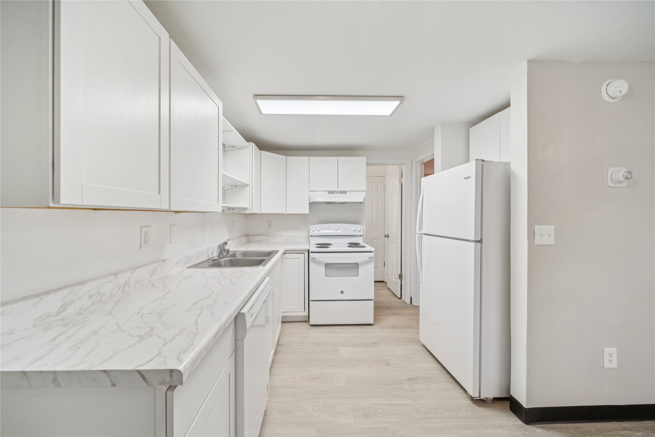 12332 End Street Other, AK 99577 - Photo 42 of 50 a kitchen with a sink a refrigerator and a stove