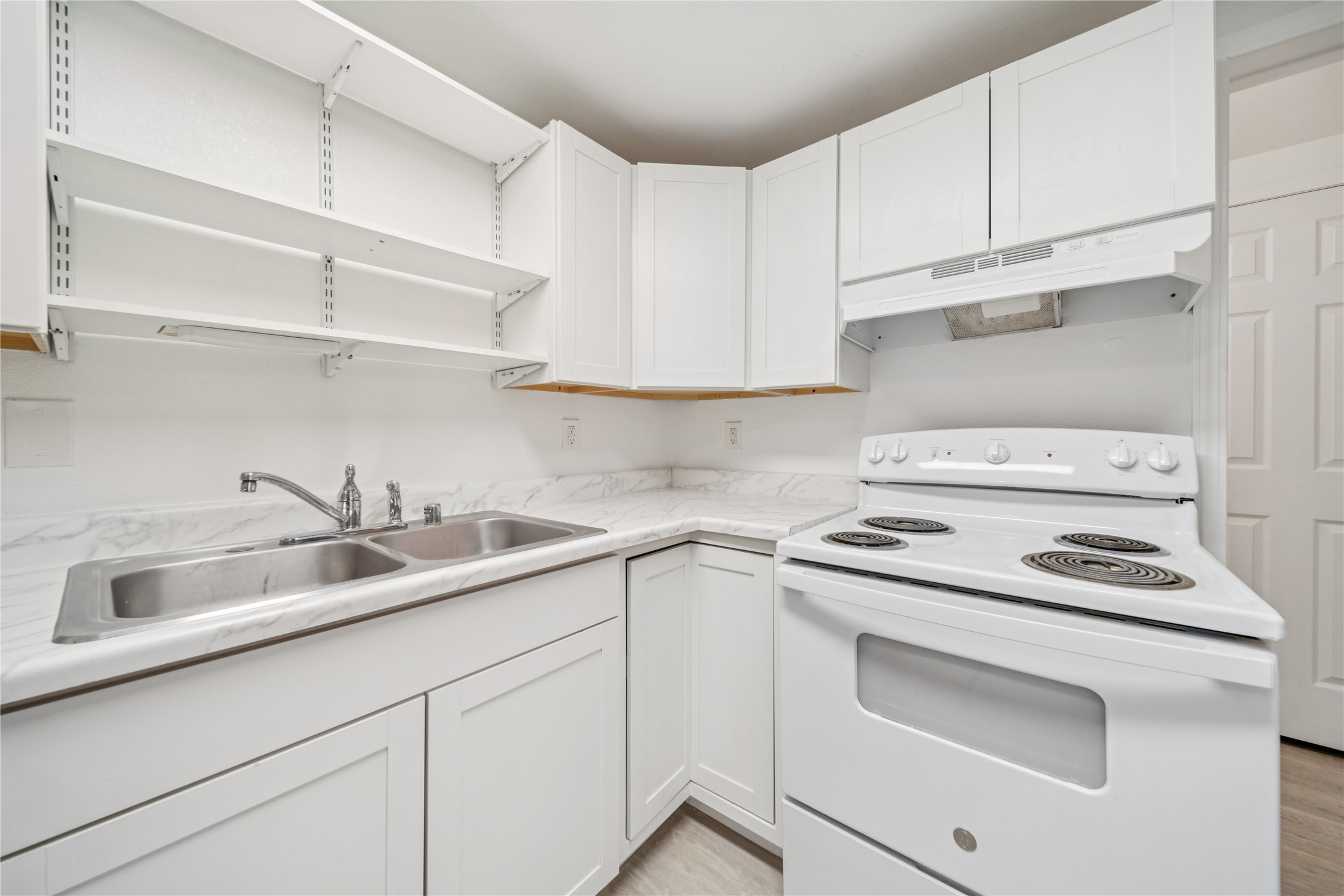 12332 End Street Other, AK 99577 - Photo 44 of 50 a kitchen with cabinets appliances a sink and a counter top