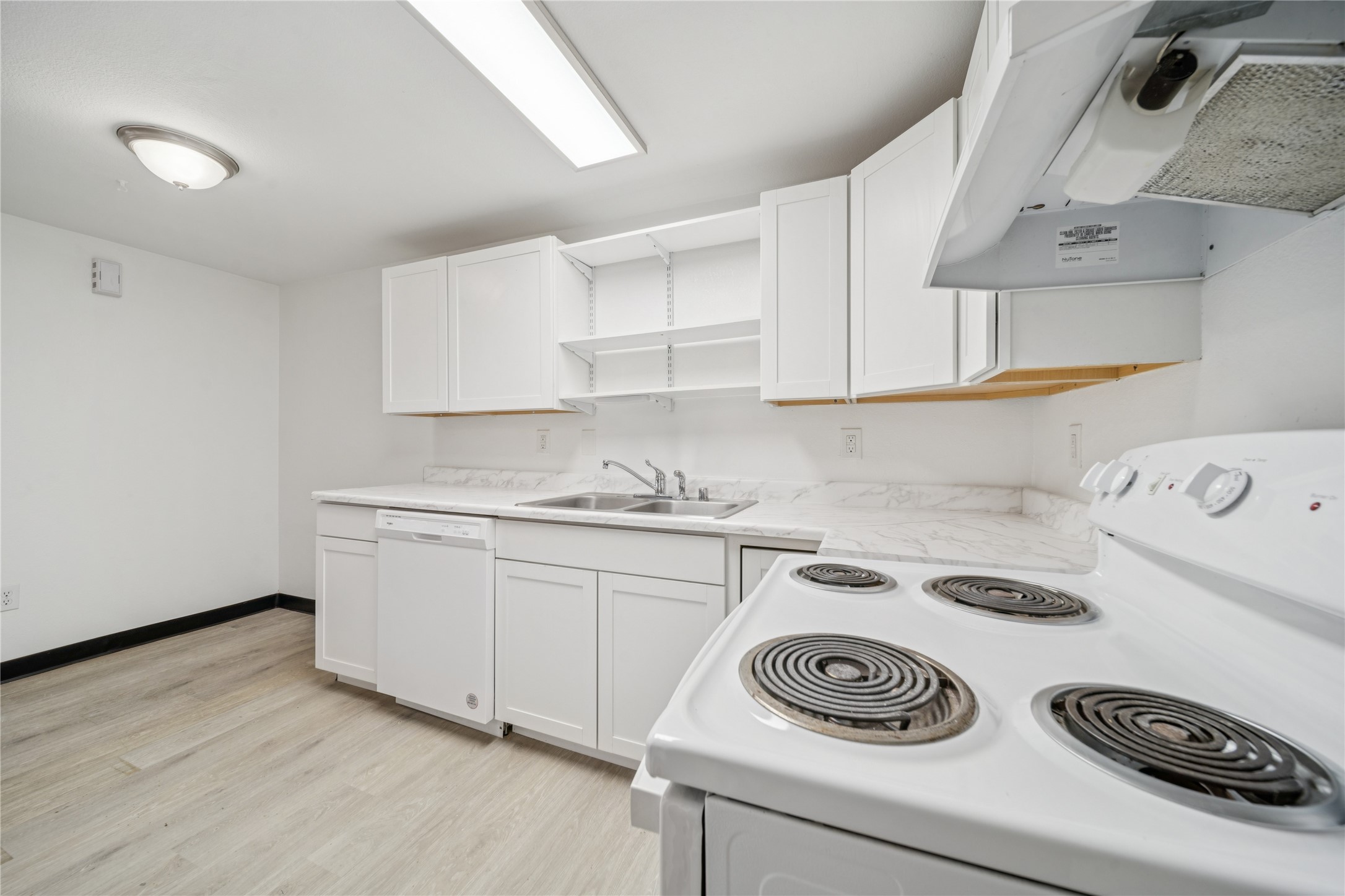 12332 End Street Other, AK 99577 - Photo 45 of 50 a kitchen with a sink a stove and cabinets
