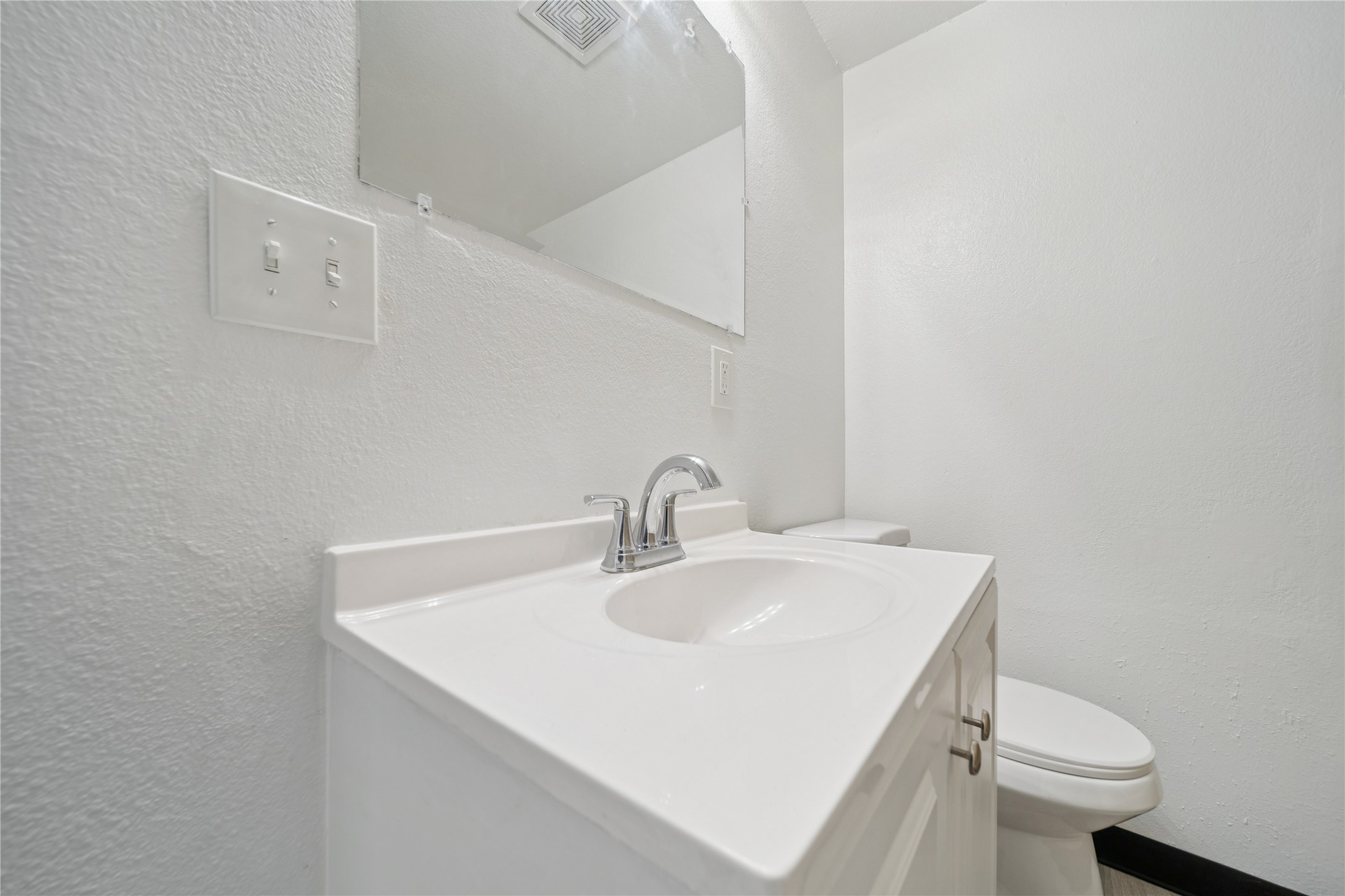 12332 End Street Other, AK 99577 - Photo 49 of 50 a bathroom with a sink a toilet and mirror