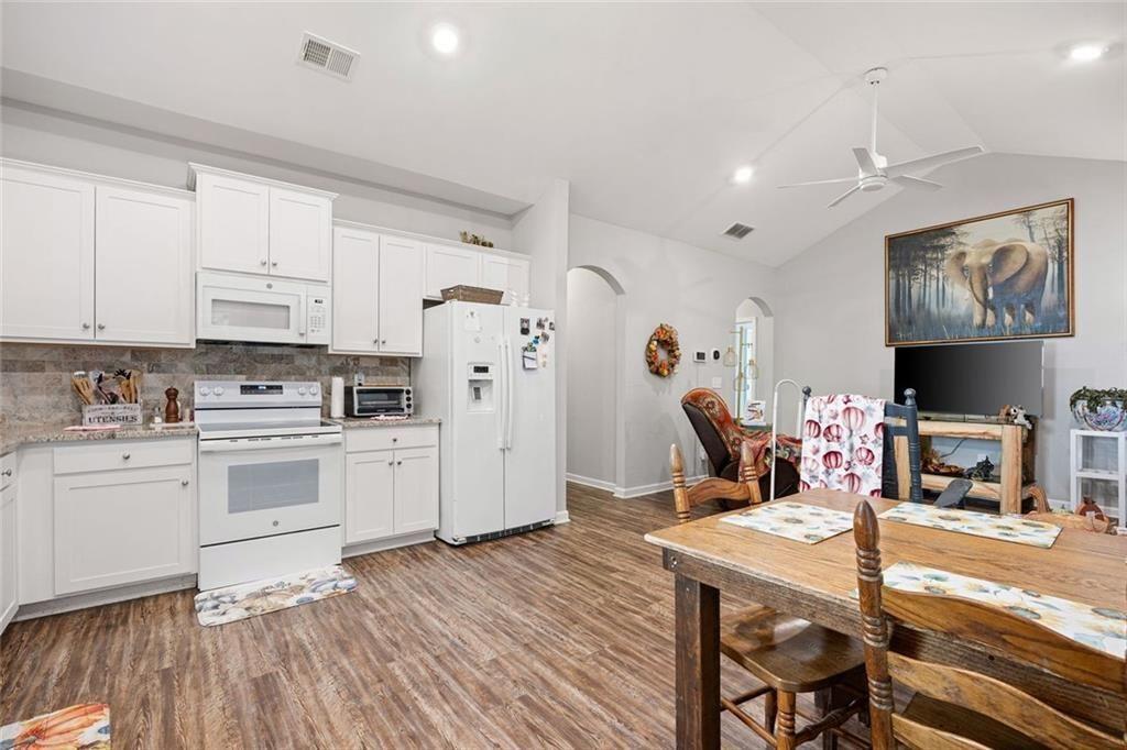 413 River Bluff Drive Temple, GA 30179 - Photo 14 of 30 a kitchen with stainless steel appliances a stove a sink and a refrigerator