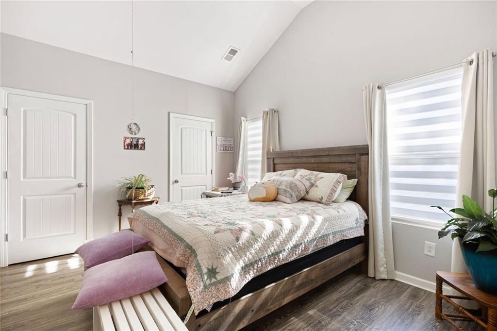 413 River Bluff Drive Temple, GA 30179 - Photo 18 of 30 a bedroom with a bed and wooden floor
