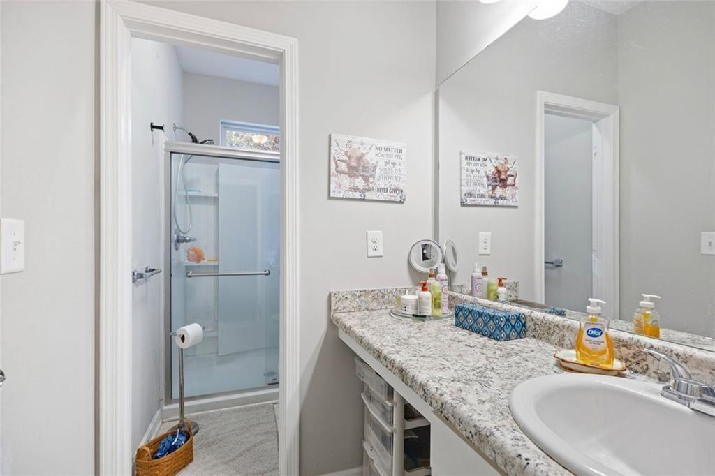 413 River Bluff Drive Temple, GA 30179 - Photo 19 of 30 a bathroom with a granite countertop sink and a mirror