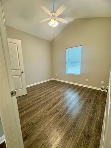 a view of walk in closet with wooden floor