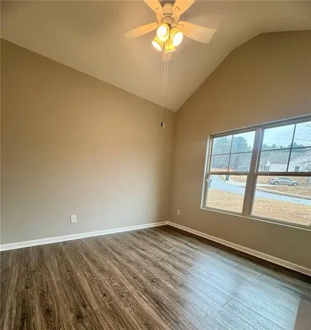 a backyard of a house with lots of green space