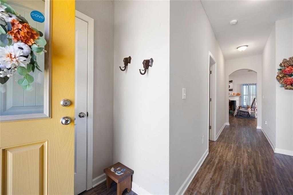 413 River Bluff Drive Temple, GA 30179 - Photo 5 of 30 a view of a hallway with wooden floor and staircase