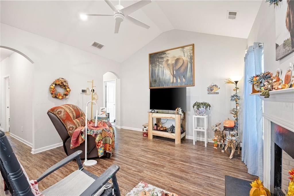 413 River Bluff Drive Temple, GA 30179 - Photo 8 of 30 a living room with furniture and a flat screen tv