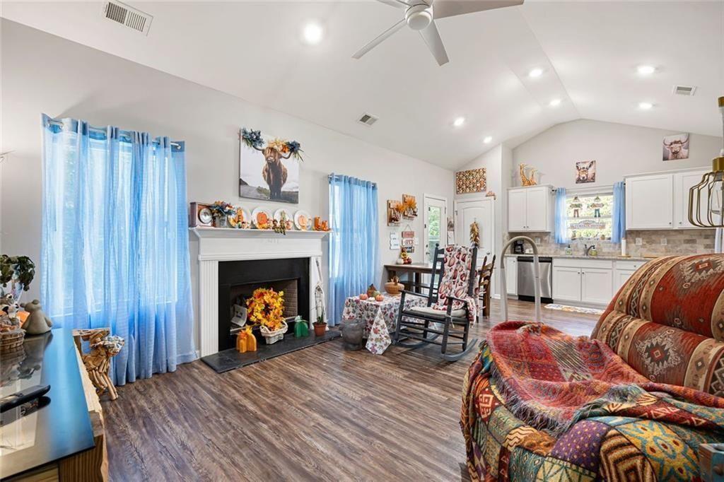 413 River Bluff Drive Temple, GA 30179 - Photo 10 of 30 a living room with furniture and a fireplace