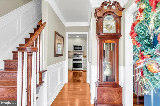 a kitchen with granite countertop a sink stainless steel appliances and cabinets