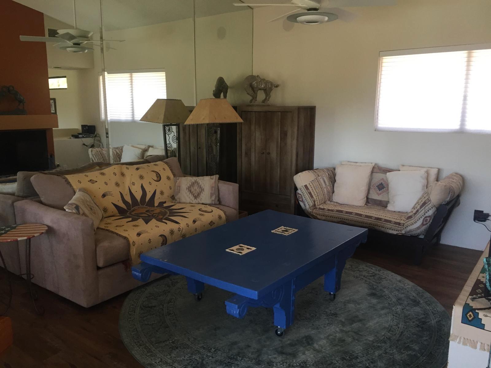 8 Mission Court Rancho Mirage, CA 92270 - Photo 13 of 17 a living room with furniture and a window