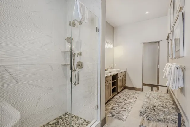 a bathroom with a tub sink and a shower