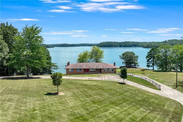 a view of a lake with a yard