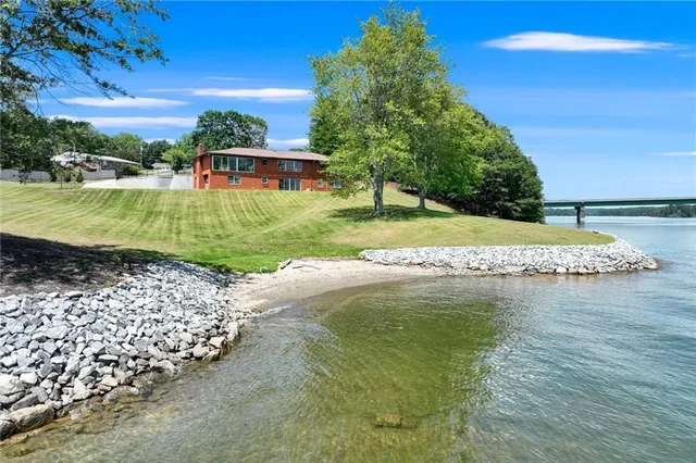 a view of a swimming pool with a yard