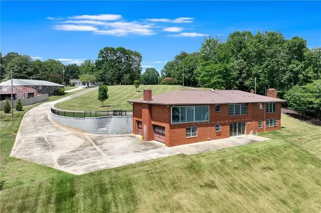 a view of a swimming pool with a patio