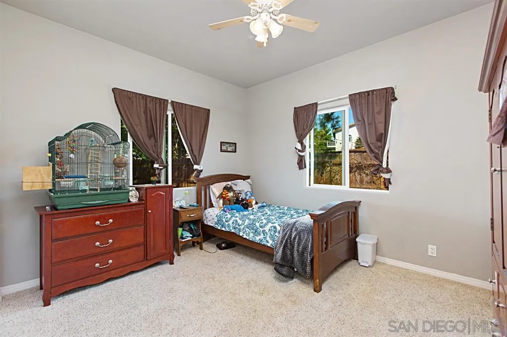 1400 Eucalyptus Drive El Cajon, CA 92021 - Photo 14 of 23 a bedroom with a bed and a dresser