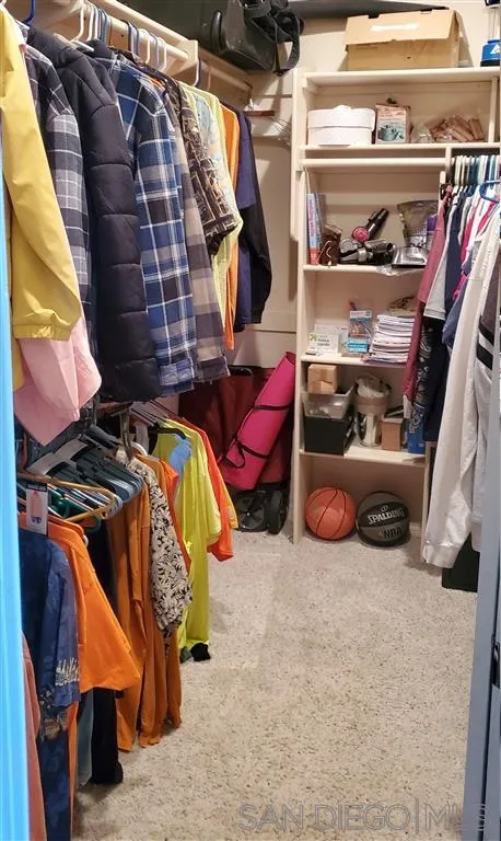 1400 Eucalyptus Drive El Cajon, CA 92021 - Photo 18 of 23 a view of walk in closet with clothes and shoes