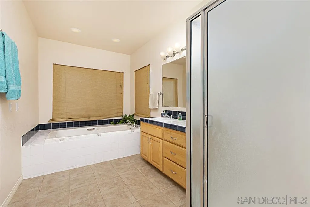 1400 Eucalyptus Drive El Cajon, CA 92021 - Photo 20 of 23 a kitchen with a refrigerator and a stove top oven