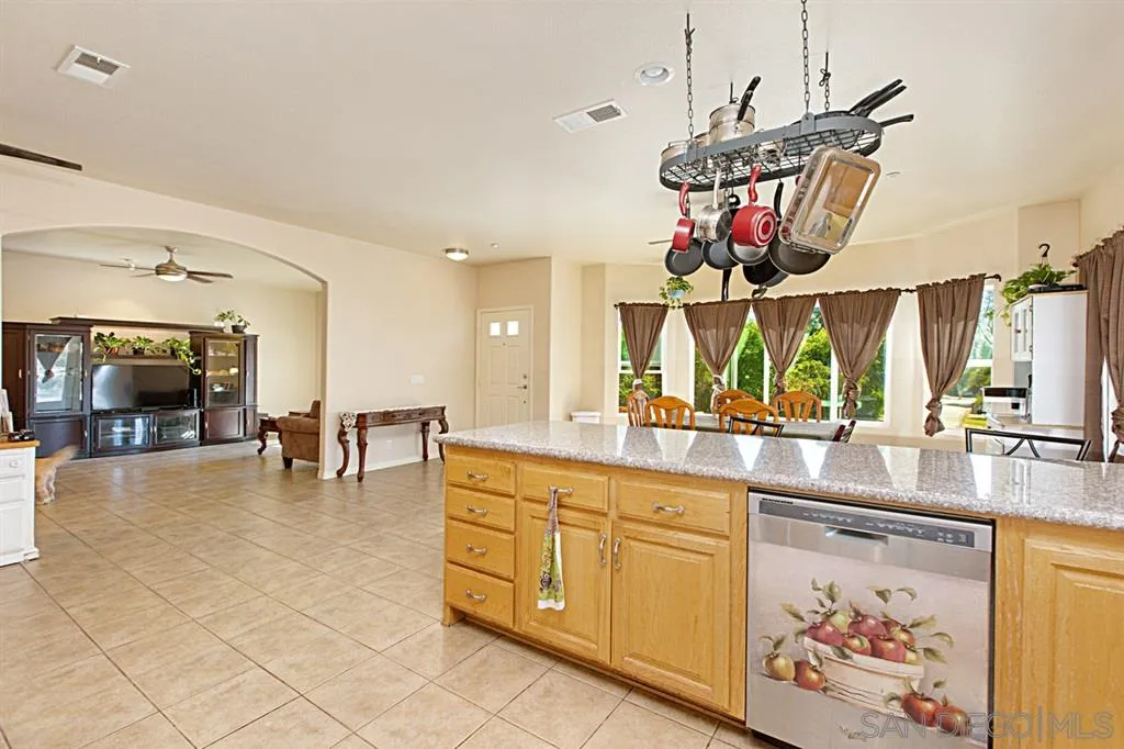 1400 Eucalyptus Drive El Cajon, CA 92021 - Photo 6 of 23 a kitchen with stainless steel appliances granite countertop a sink and cabinets