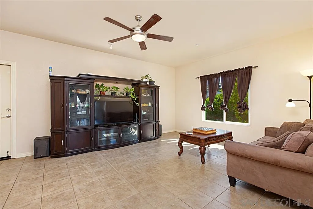 1400 Eucalyptus Drive El Cajon, CA 92021 - Photo 10 of 23 a living room with furniture and a flat screen tv